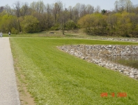 No trees or brush on dam embankments.